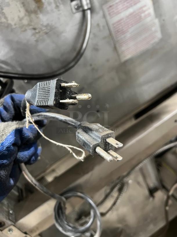 Blodgett commercial double stacked convection oven, stainless steel, natural gas, with wired rack, on legs.