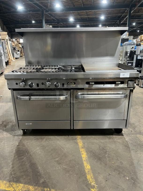 Southbend commercial stainless steel range with griddle, double oven, back and side splash, overhead salamander shelf, on casters.