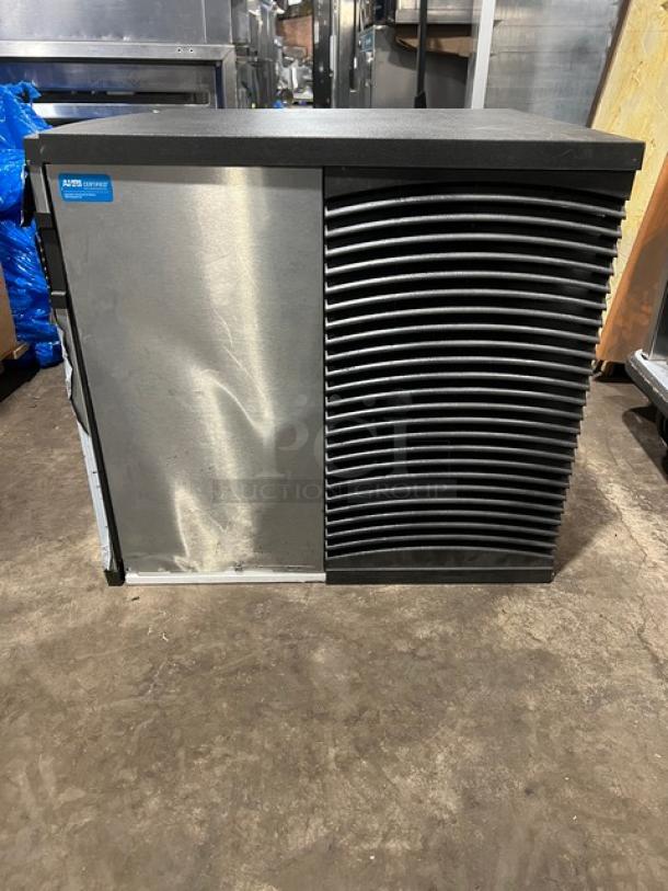 Commercial stainless steel electric ice making machine head, featuring a durable design. Visible label reads "AISIS." Good condition.