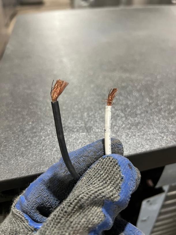 Stainless steel electric ice maker head, wires exposed; needs repair, suitable for commercial use.