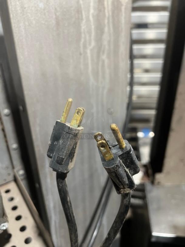 Southbend SilverStar stainless steel double convection oven, gas-powered, on casters, with wired rack. Features durable plugs.