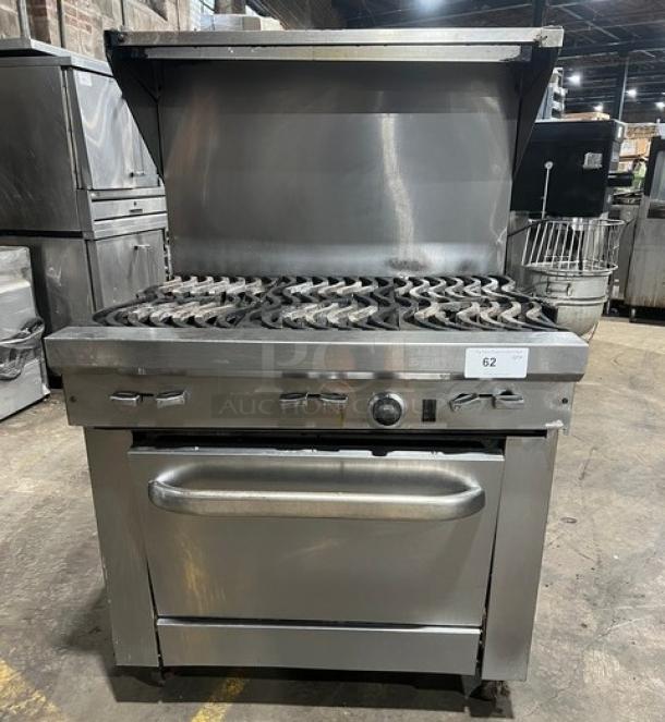 Southbend commercial stainless steel 6-burner range/oven combo with backsplash, overhead salamander shelf, and wired oven rack on casters.