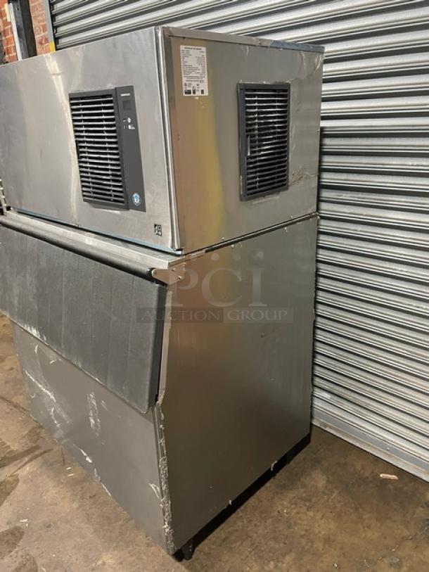 Hoshizaki IM-500SAA commercial ice maker, stainless steel, air-cooled, with bin and ice scoop. 115V, 1 phase, on legs.