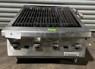 Garland stainless steel gas-powered countertop char broiler with legs; features control knobs and brand label; used condition.