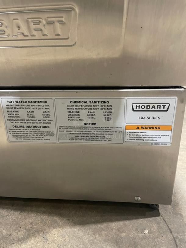 Hobart LXE Series stainless steel undercounter dishwasher, model LXEH, new body style, serial 23-1149-570, 120/208-240V, 1 phase, features sanitizing instructions and warning labels.