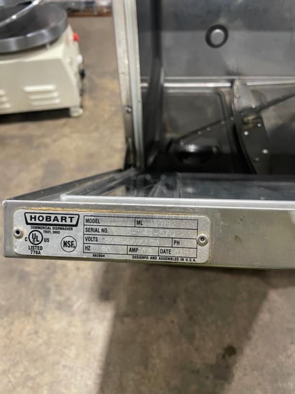 Hobart LXEH commercial stainless steel high-temp dishwasher with visible model and serial number tag. Electric, undercounter design.