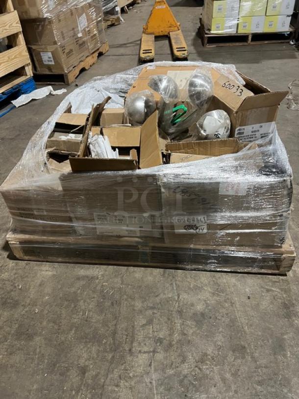 Mixed pallet of new commercial kitchenware including Vollrath tongs and pan, Steelite teaspoon, serving ladle, and coffee kettle.