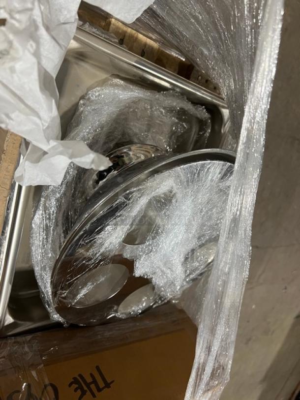 Mixed pallet with new commercial kitchenware including Vollrath utility tong, hotel pan, and Steelite teaspoon. Packaged condition.