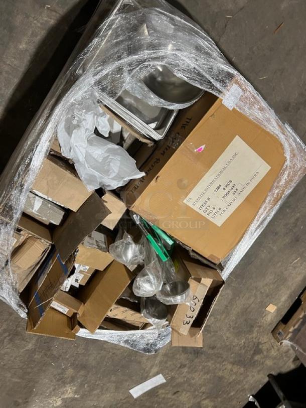 Mixed pallet of brand new commercial kitchenware including Vollrath utility tongs, Super Pan V, Steelite teaspoon, and more.