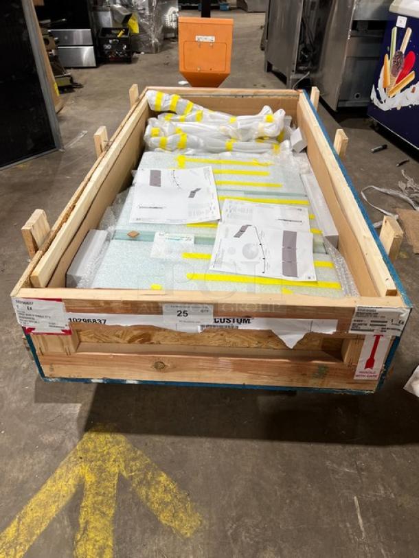 Brand new BSI ZGuard Series tempered glass sneeze guard, 27" height, Model ZG9500-4, in shipping crate with protective packaging.