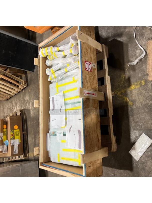 Brand new BSI ZGuard Series, Model ZG95004, 27" height tempered glass sneeze guard in packaging on wooden pallet.