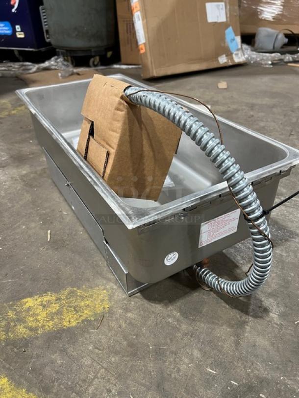 Brand new Wells 5PSS276TDU stainless steel electric hot food well, 12"x27", drop-in design with thermostatic control.