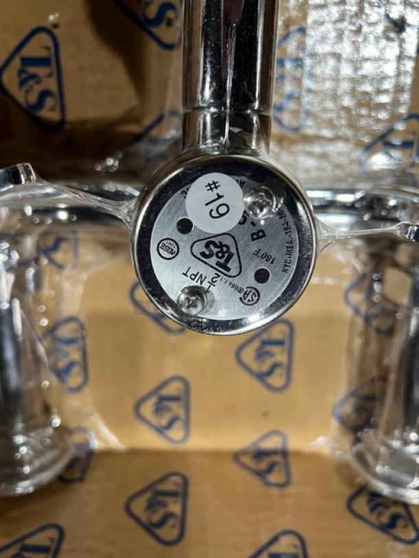 Brand new T&S wall-mount service sink faucet, polished chrome, model B0655BSTP. Features 8" centers, #19 sticker.