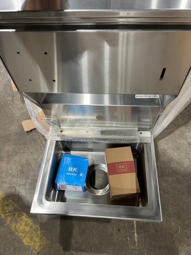 BRAND NEW BK Resources stainless steel wall-mount hand sink, model BKHSW141014DTD, with towel and soap dispenser, single splash-mount faucet hole.