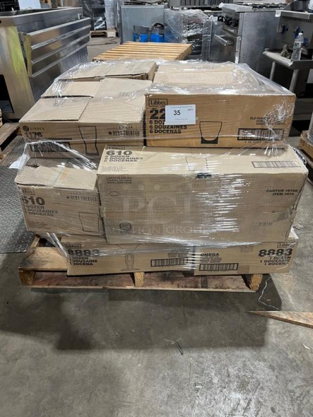 Mixed pallet of brand new Libbey glassware, including Omega martini glasses, Governor Clinton water glasses, and more in boxes.