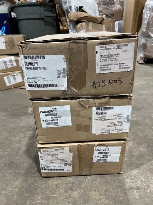 Brand new Cambro Pro Cart Ultra PCMHX615 modules in boxes. Model and serial numbers visible. 115V, adjustable temperature.