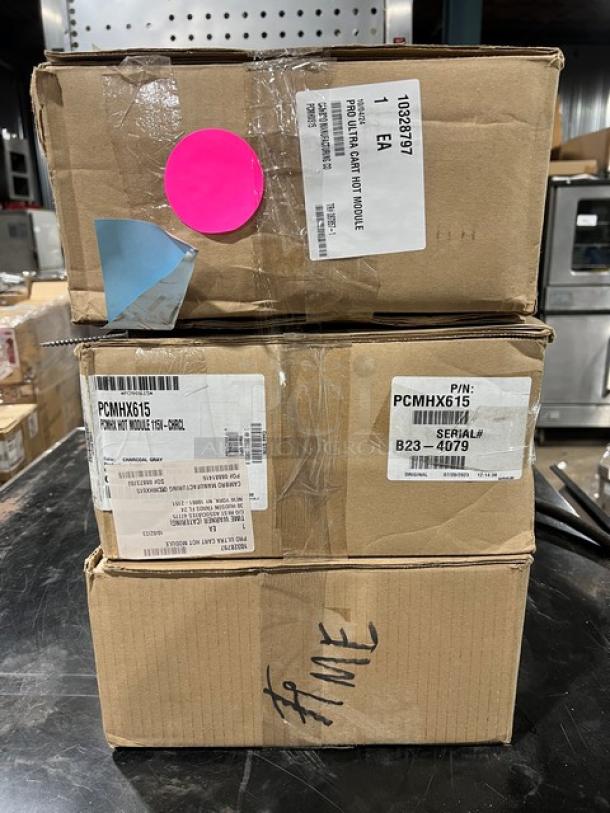 Auction image of Cambro Pro Cart Ultra Series, Model PCMHX615, in box. Features electric-powered hot module, adjustable temperature. Brand new condition.