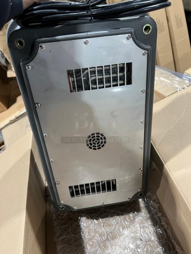 Brand new Cambro Pro Cart Ultra PCMHX615 charcoal gray electric hot module, adjustable temperature, 115V, shown in packaging.