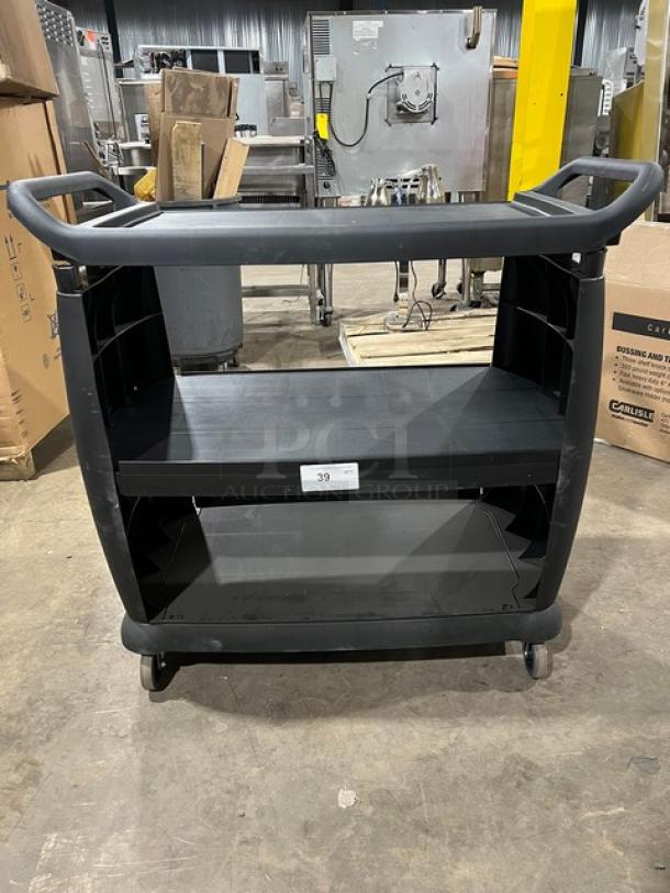 NEW Carlisle Commercial Black 3-Tier Utility Cart on casters, minor dents, sturdy handles, ideal for heavy-duty use.