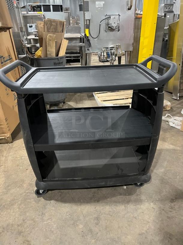 Carlisle 3-Tier Black Utility Cart on casters, new condition with minor scratches, sturdy build, large handle grips.