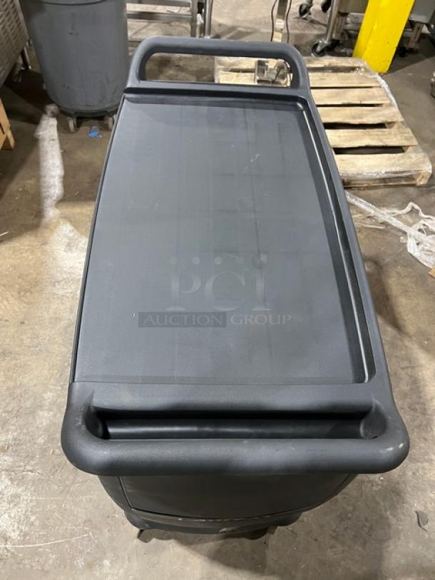 Carlisle black 3-tier utility cart, new condition, minor scratches, on casters for easy mobility.