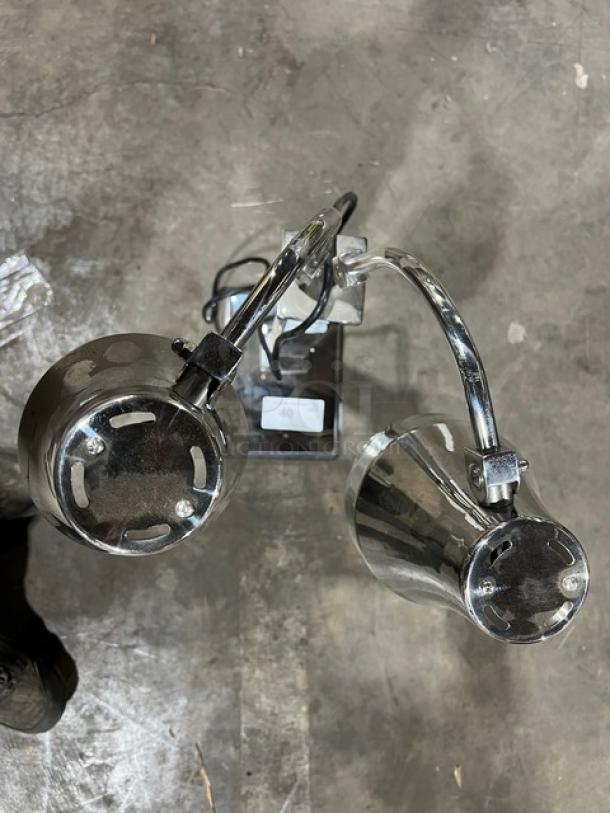 Commercial stainless steel double-head heat lamp with individual power controls, brand new condition, two bulbs visible.