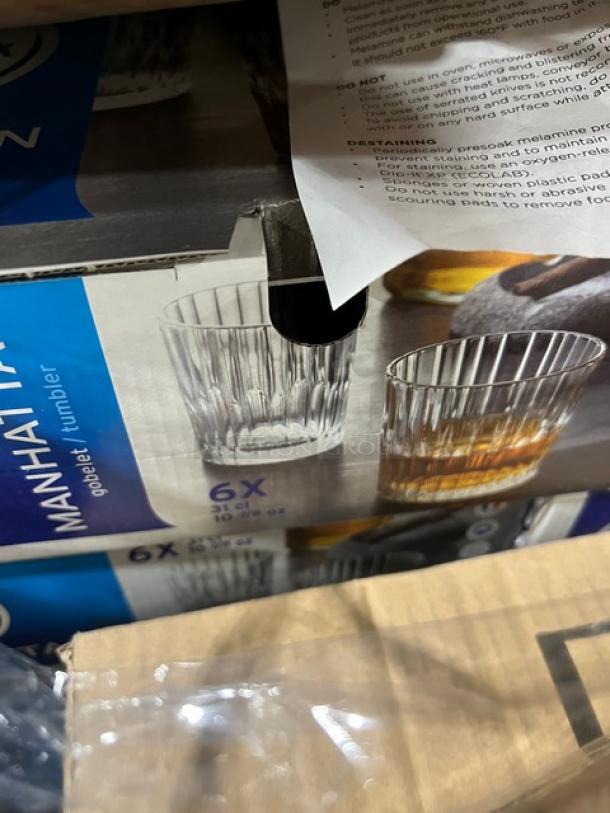 Brand new mixed pallet with boxes showing Manhattan tumblers, 6 per pack, in sealed packaging. Suitable for commercial use.
