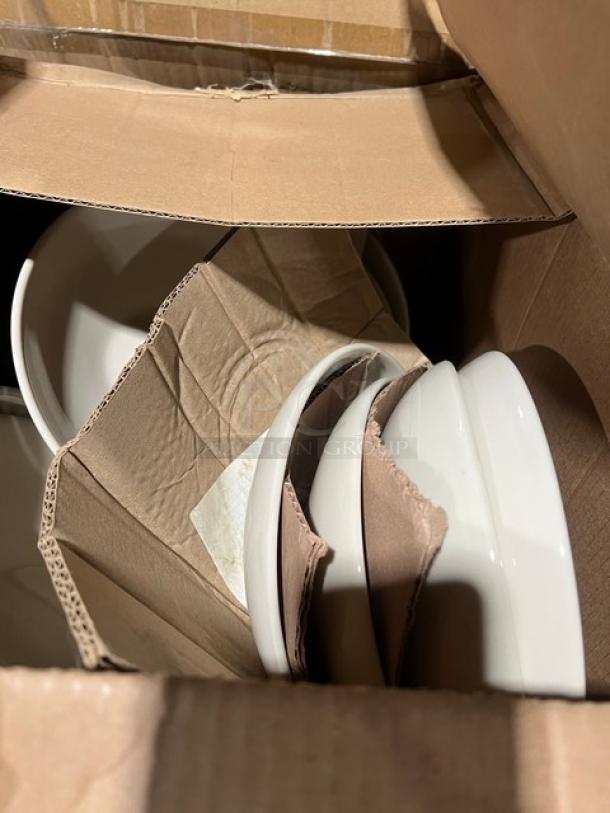 Cardboard box with white china bowls visible; likely part of a mixed pallet auction lot containing various new commercial kitchen items.