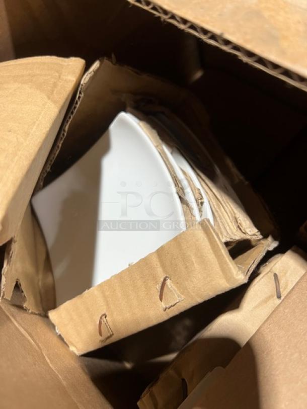 Boxed commercial tableware items including a white 4" square flared plate in new condition.