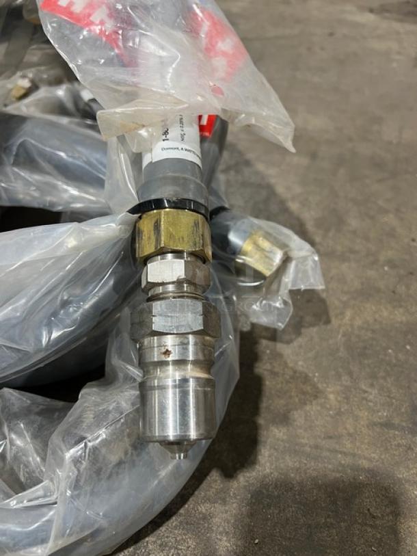 Brand new Dormont W75BP60 3/4" x 60" coated water appliance connector hose with visible fittings and protective wrap.