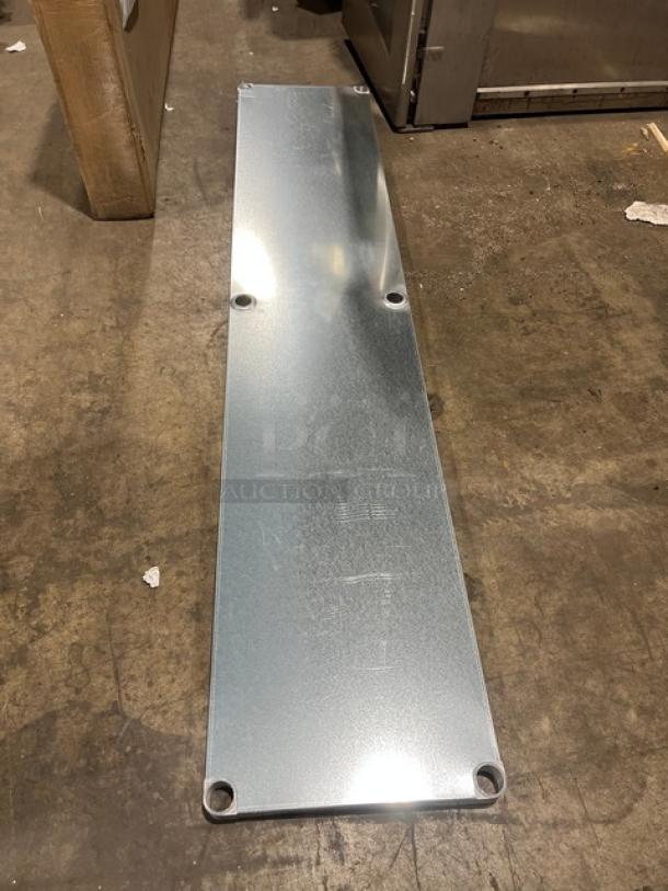 Brand new Advance Tabco UG-24-96 worktable undershelf; 18 gauge galvanized steel; 24"x96"; adjustable; keyholes visible.