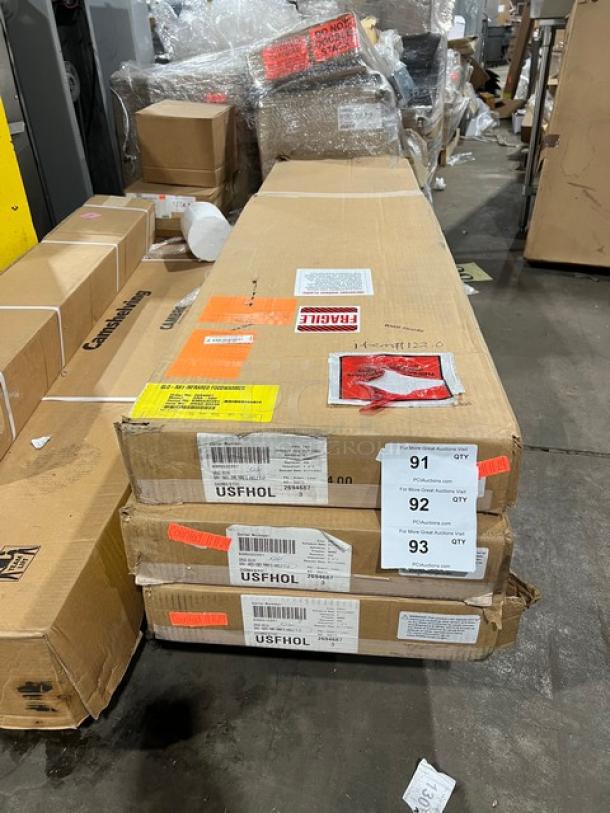 Brand new Hatco GRA-60D dual infrared warmer in box, 60" aluminum, 208V, 1 phase, model SN: 9305532201, fragile labels visible.