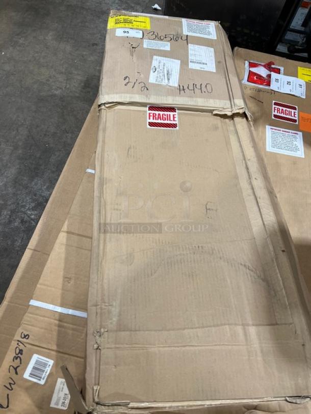 Brand new Hatco Glo-Ray 54" infrared warmer, Model GRAHL-54D, in original packaging with Fragile labels.