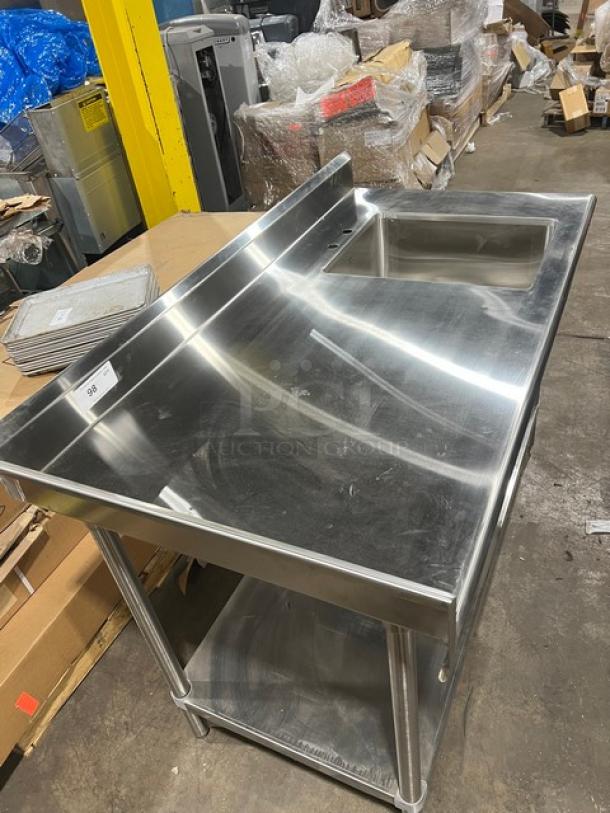 Advance Tabco stainless steel worktop/prep table with undershelf, right-side sink, back, and left-side splash, on legs; brand new.