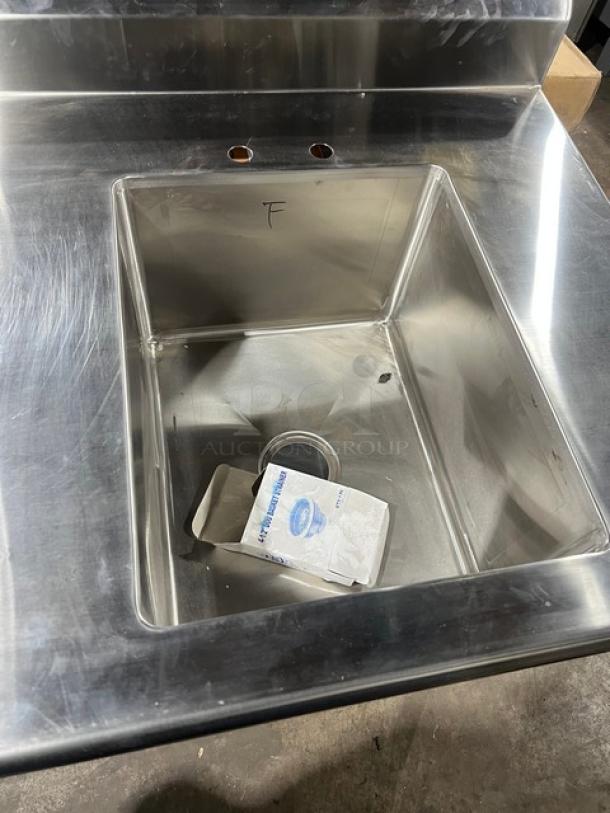 Brand new Advance Tabco stainless steel worktop with right-side sink, back and left-side splash, on legs, pristine condition.