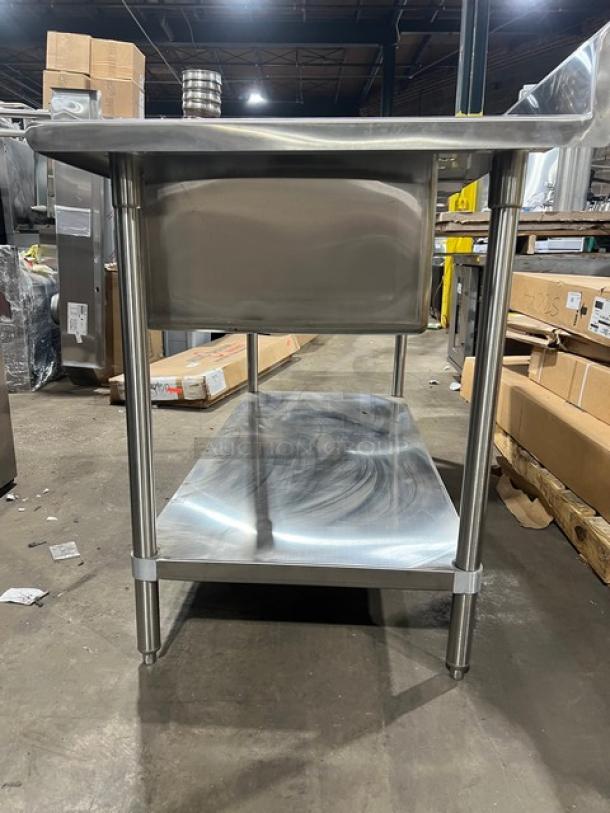 Brand new Advance Tabco stainless steel worktop table with undershelf, single compartment sink, right side splash, and legs.