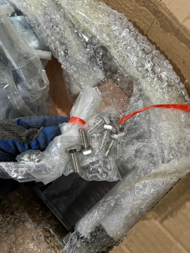 Brand new commercial double convection oven stacking kit with casters, includes hardware; wrapped in bubble wrap for protection.