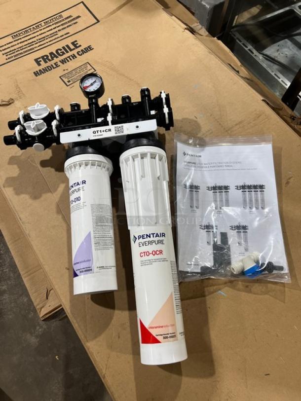 Brand new Pentair Everpure QT1+CR water filtration system with chloramine reduction features, includes manual and fittings.