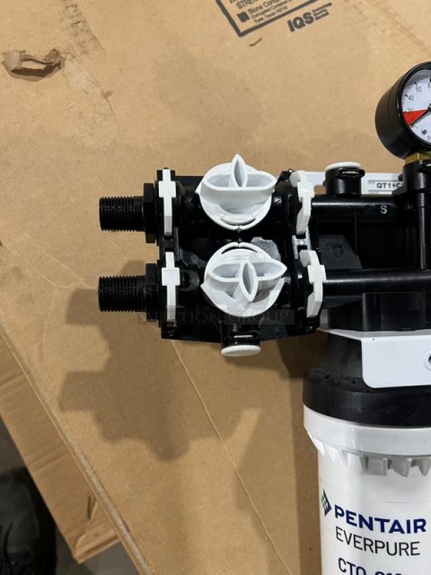 Brand new Pentair Everpure QT1+CR water filtration system, commercial-grade, features chloramine reduction; model label visible.