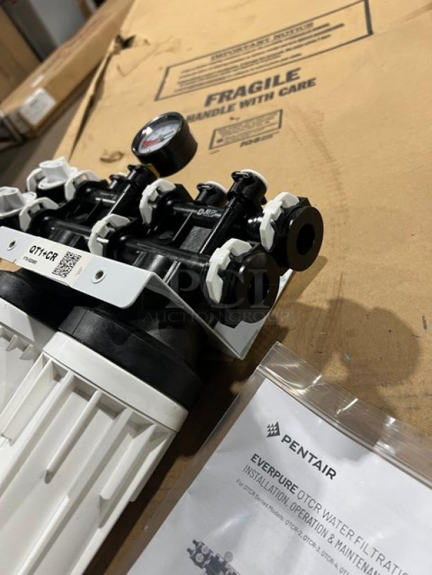 Brand new Pentair Everpure QT1+CR water filtration system, with dual filters, pressure gauge, and instruction manual.