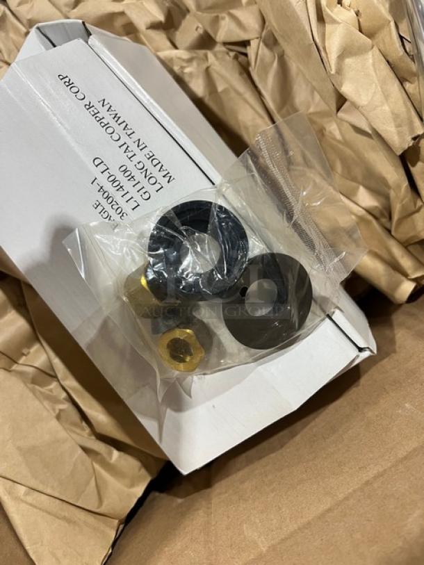 Close-up of packaging for Eagle Group commercial sink fittings, including washers and brass nuts, labeled as made in Taiwan.