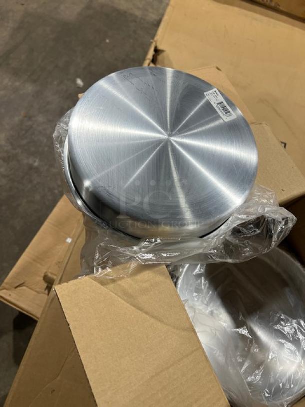 Winco ACP-092 aluminum cake pan, 9" round, 2" deep, brand new. Features durable construction and smooth finish.