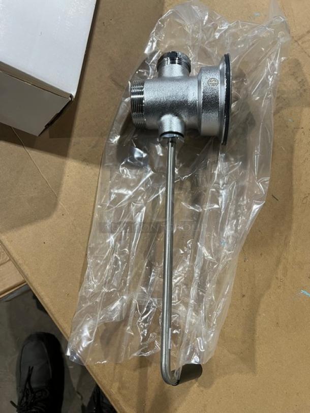 Brand new T&S B3940 commercial waste drain valve with twist handle, shown in packaging.