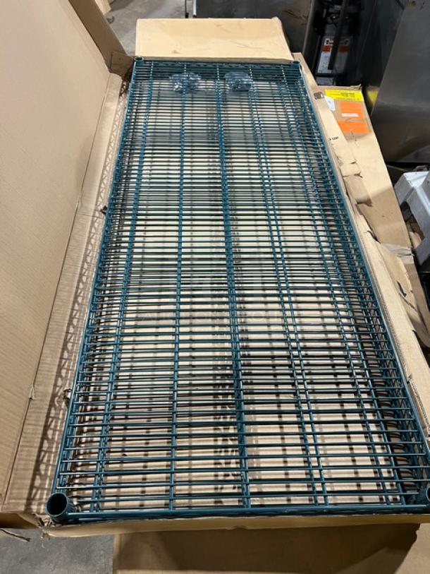 Brand new Advance Tabco 60"x24" green epoxy-coated wired shelving in packaging; 2 per case, ideal for commercial use.