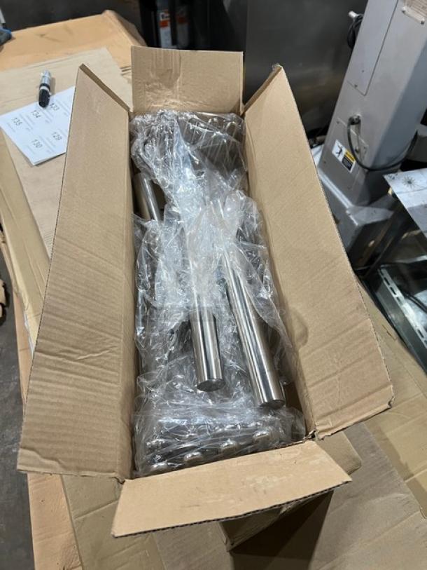 Brand new TableCraft 7418 stainless steel handheld potato masher, 18" square face, in open packaging.