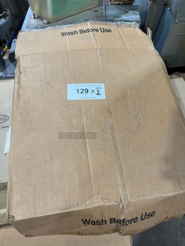 Box of Carlisle Bronco Series Commercial Black Round Trash Can Dollies, Model 36910, marked "Wash Before Use."