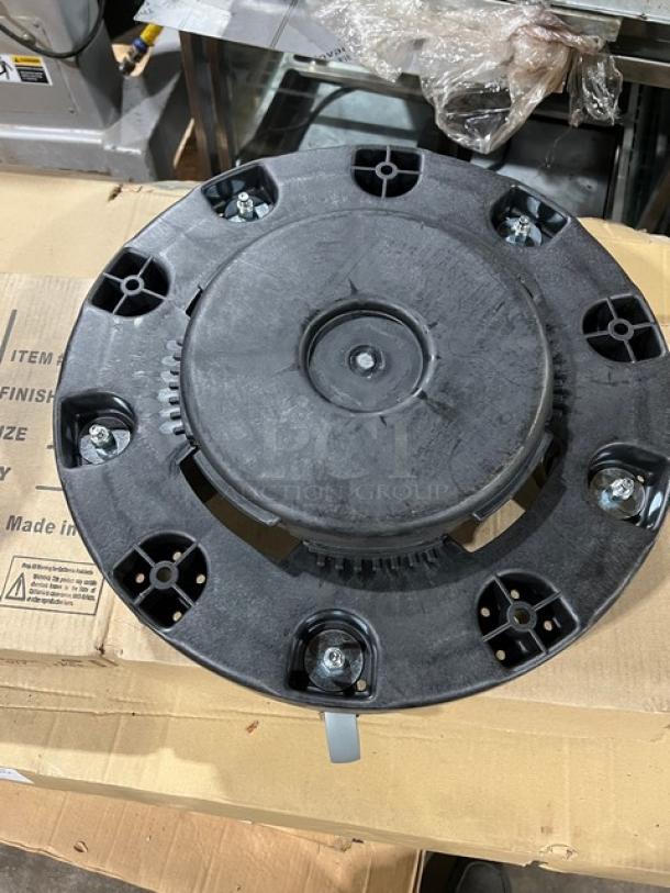 Carlisle Bronco Series commercial black trash can dolly, Model 36910. New condition, sturdy design with wheels.