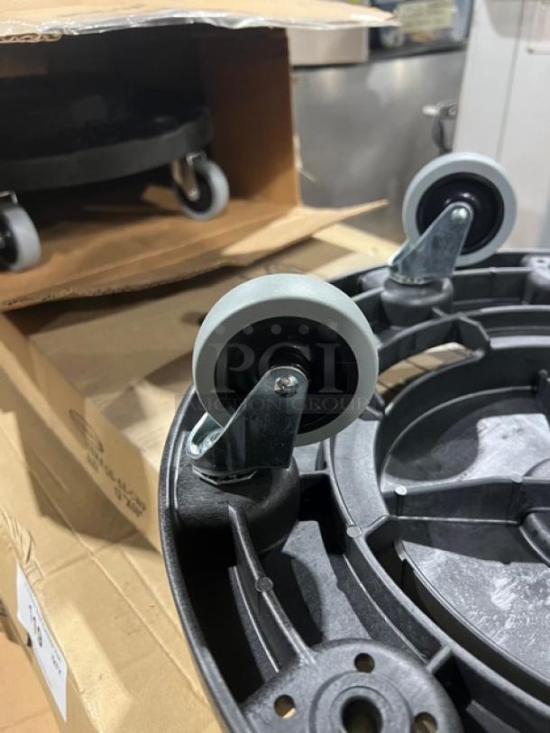 Brand new Carlisle 36910 Bronco Series black trash can dolly, featuring durable wheels and sturdy construction.