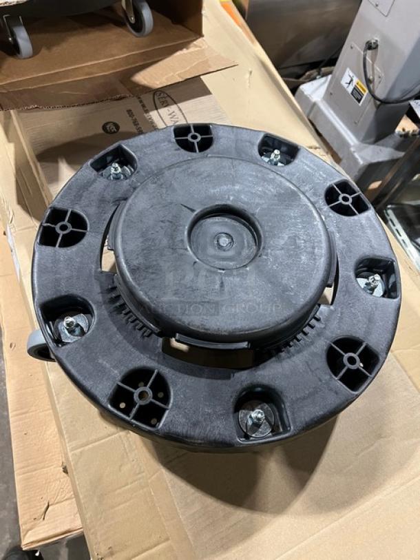 Brand new Carlisle Bronco Series black round trash can dolly, Model 36910, with sturdy wheels and durable plastic.