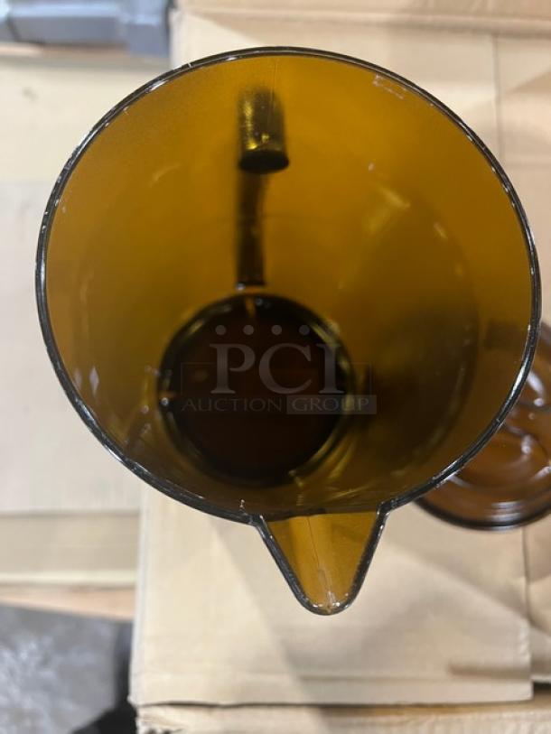 Brand new G.E.T. Enterprises 64 oz amber textured pitcher with lid, Model P-3064-1-A, shown from top view.